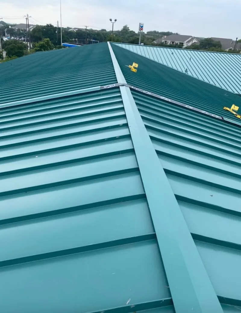 Green commercial metal roof ridge and valley for Metal Roof Repair in North Fayette